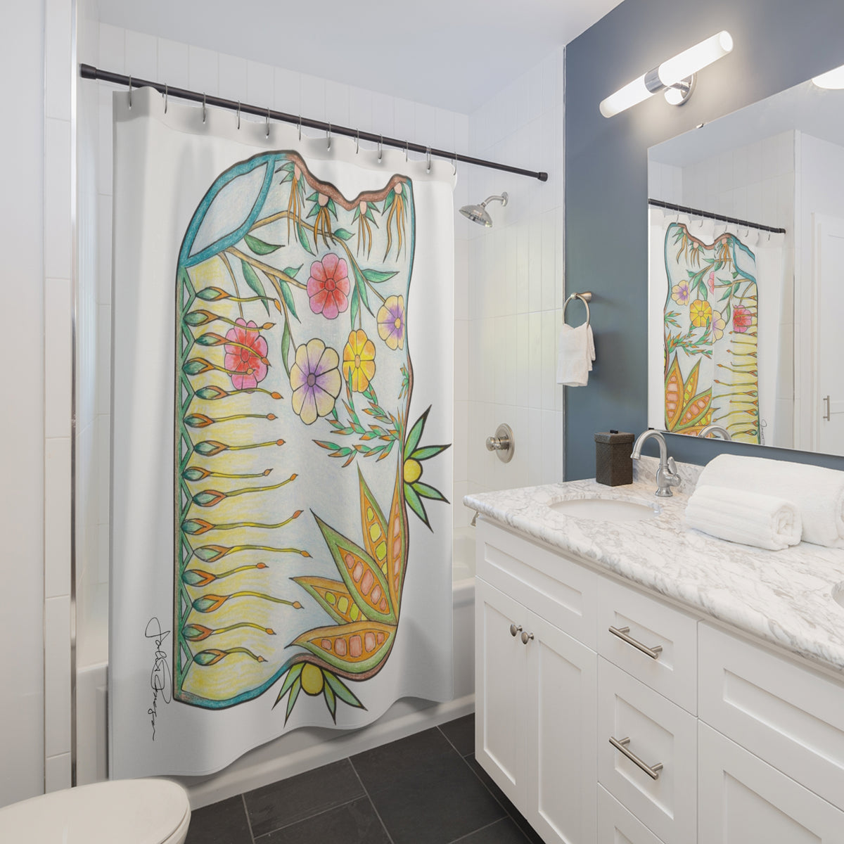 A white fabric shower curtain featuring a large colorful floral and leaf illustration, hanging in a modern white bathroom